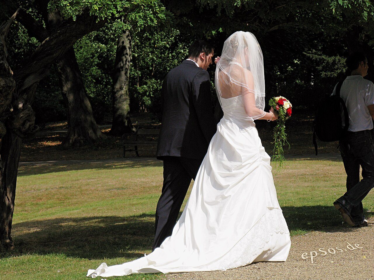 A couple in wedding dress with flowers
